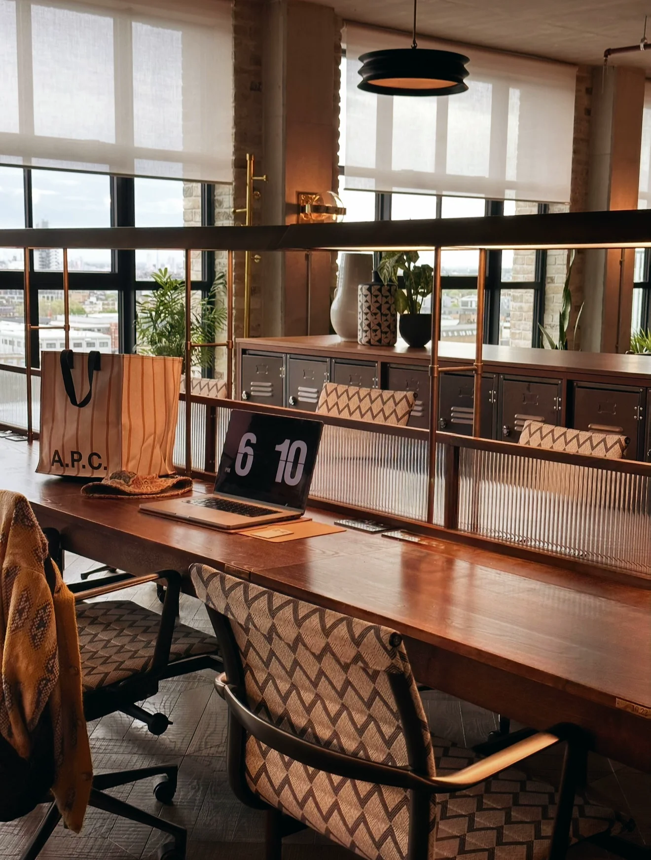 Warm design studio workspace overlooking the city